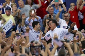 Smiling Romney and Ryan in the middle of a crowd only have eyes for each other