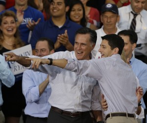 Romney and Ryan, each with arm around other, point with glee.